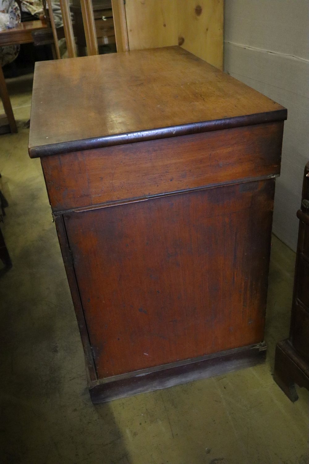 An early Victorian mahogany cabinet, fitted two drawers over panelled doors, width 114cm depth 67cm height 96cm